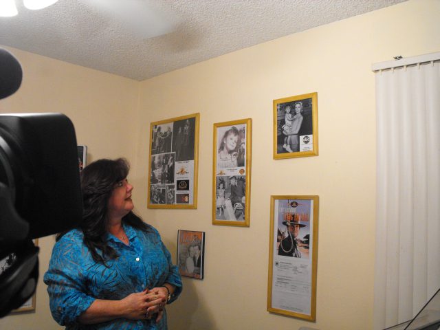 Tammylocke Looking At The Photos On Wall
